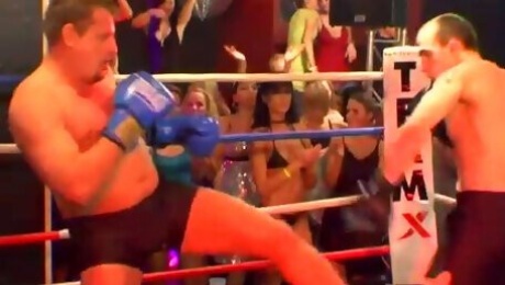 Nasty bitches are masturbating watching boxers fighting on a ring