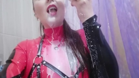 Latex Rubber Catsuit And Milk In The Bath. Leather Harness and Fetish Costume. Funny Video